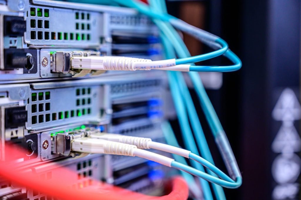 close-up-photo-of-cables-plugged-into-the-server-2881233 Detailed shot of Ethernet cables connected to server ports highlighting technology infrastructure.